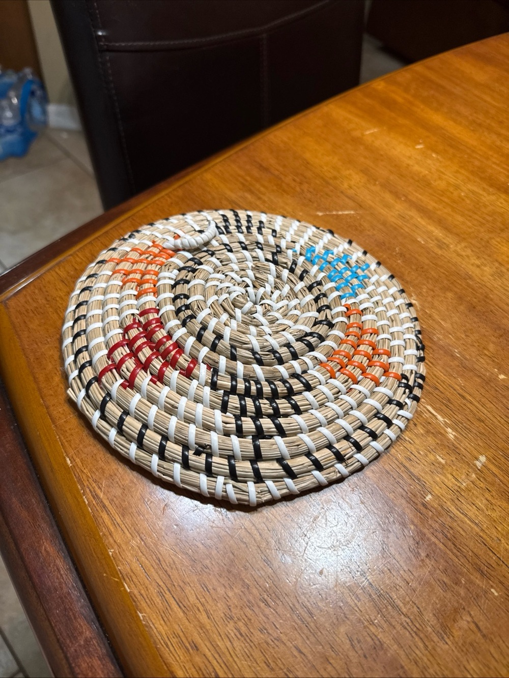 Handwoven Round Woven Coaster - Natural with Black, Orange, Red & Blue Accents